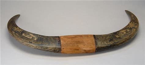 Lot - PAIR OF MOUNTED WATER BUFFALO HORNS with carved WWII-era decoration of houses, palm trees ...