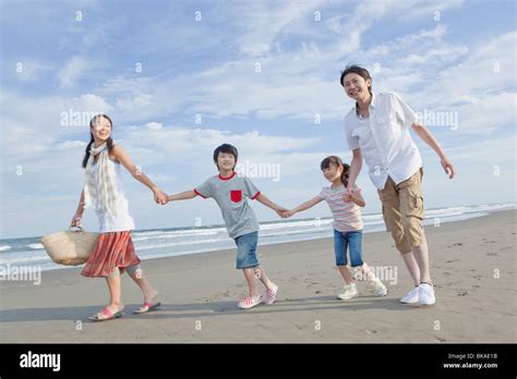 Family Walking Beach Stock Photo - Alamy