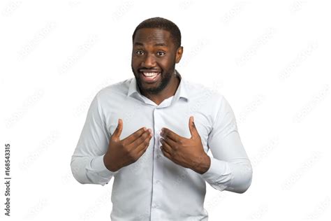 Smiling man pointing at himself with two hands. Afro american man in ...