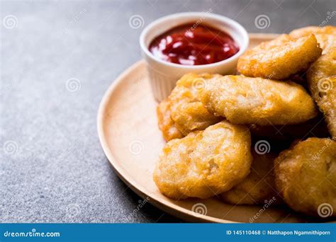 Chicken nuggets with sauce stock photo. Image of chicken - 145110468