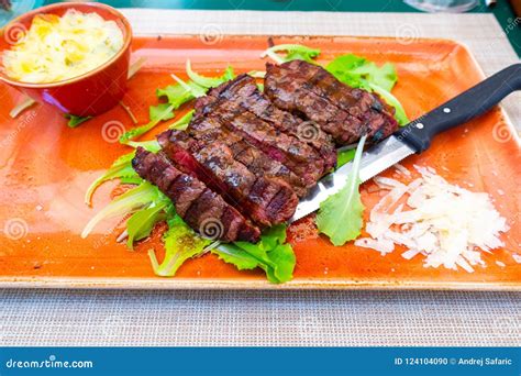 Traditional Italian Tagliata Steak with Parmesan and Salad As Close-up on a Plate Stock Photo ...