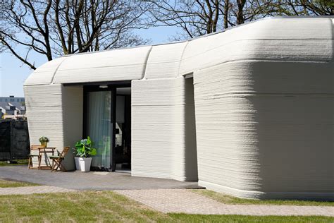 Couple takes up residence in boulder-shaped 3D-printed home