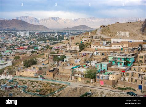 Kabul Afghanistan city scape skyline, capital Kabul hills and mountains with houses and ...