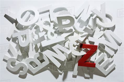 A heap of white block letters with a red letter Z - Stock Photo - Dissolve