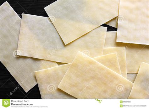 Dry Lasagna Pasta Sheets on Black Textured Wood from Above. Abst Stock Image - Image of wood ...