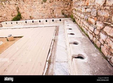 Ancient roman latrine public toilets at Ephesus in Turkey Stock Photo - Alamy