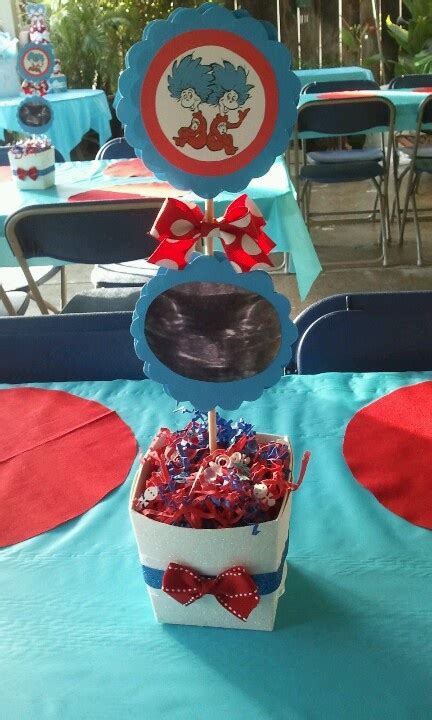 there is a table set up with red, white and blue candy in a bucket