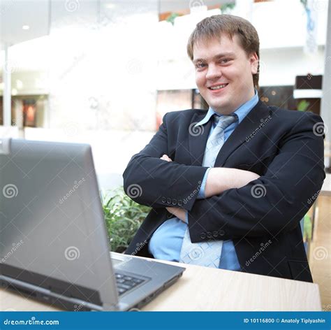 Happy Young Businessman with Laptop Stock Photo - Image of happy, portable: 10116800