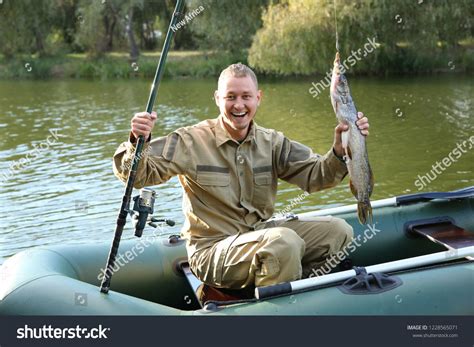 Man with rod and catch fishing from boat. Recreational activity #Ad , # ...