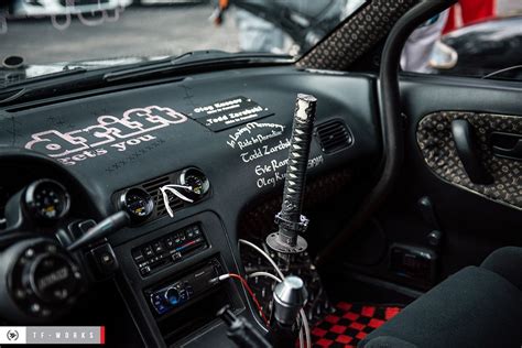 the interior of a sports car is decorated with stickers and writing on ...