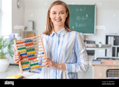 Beautiful math teacher in classroom Stock Photo - Alamy