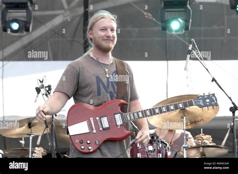 Guitarist Derek Trucks is shown performing on stage during a "live ...