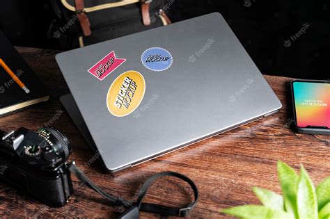 Premium PSD | Adhesive sticker on laptop device