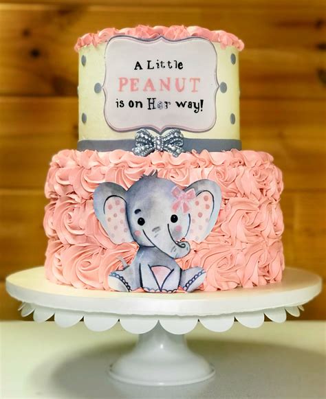 Two tier buttercream baby shower cake with hand painted peanut sign ...