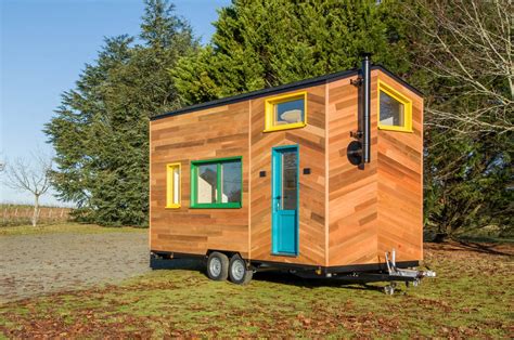 This tiny home on wheels uses colourful windows to create a fun space for a young family - MINDGuros