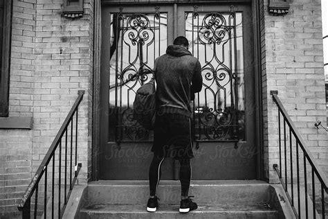 "Young Black Man Leaving Home For Morning Workout" by Stocksy Contributor "Rob And Julia ...