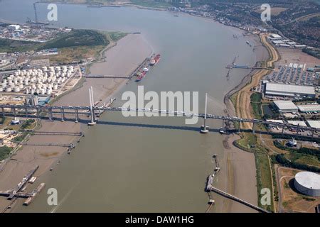 An aerial view showing the QE2 Bridge over the River Thames at Thurrock illuminated by sunlight ...