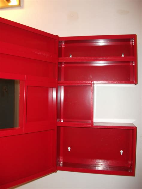 Moving out of Timmins sale: Red IKEA medicine Cabinet