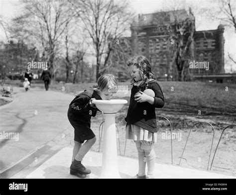 Children Drinking Water Fountain Park High Resolution Stock Photography ...