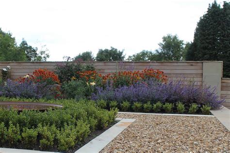 Modern terraced garden with level lawns and colourful planting