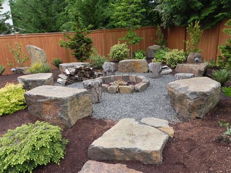 Furniture Large Fire Pit With Large Stone As A Seat Also Plants ... | Fire pit landscaping, Fire ...