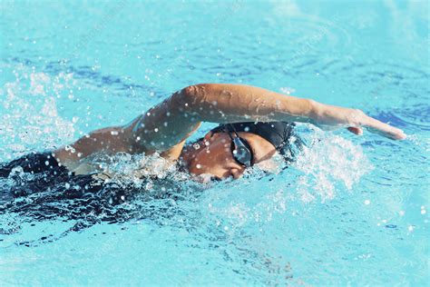 Woman swimming front crawl - Stock Image - F024/7875 - Science Photo Library