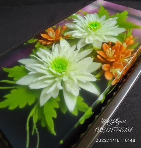 an image of some flowers in the middle of it's glass display case on a table