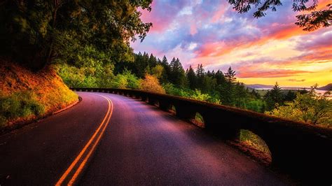 Colorful sunset over a mountain road, mountain, colors, sunset, road, trees, HD wallpaper | Peakpx