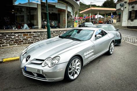 a silver sports car parked on the street