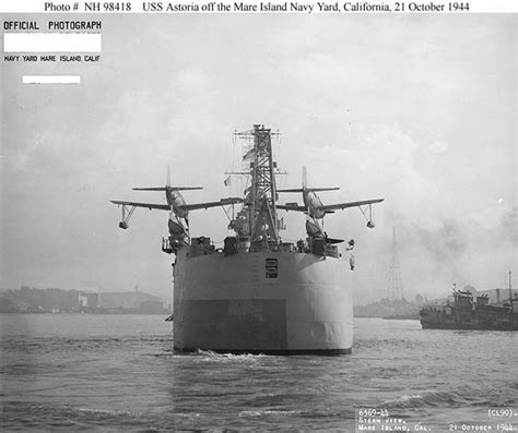 USS Astoria (CL-90) stern view. Her OS2N-1 Kingfisher floatplanes sit ...