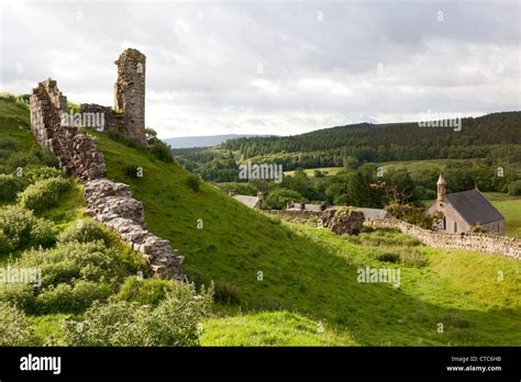 The ruins of Harbottle Castle with the village below, Northumberland ...