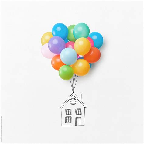 Bunch of colorful air balloons holding drawing house on a white background with space for text ...