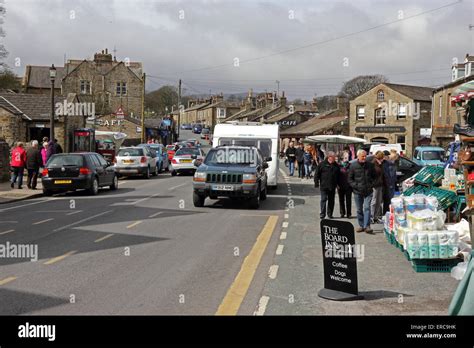 Caravan being towed through Hawes on Market Day Stock Photo - Alamy