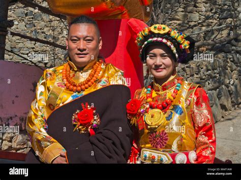 A newly wed couple in traditional Tibetan clothing, Jinchuan County, Sichuan Province, China ...