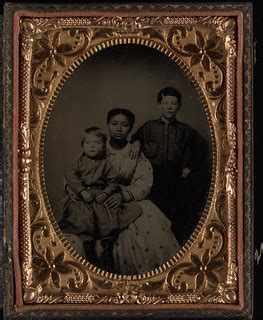 Full length group of three; black woman seated with white … | Flickr
