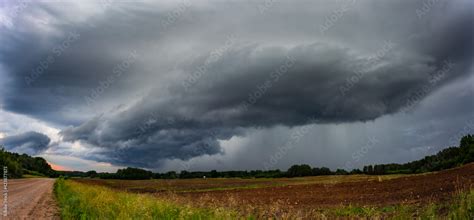 Supercell storm clouds with wall cloud and intense rain Stock Photo ...