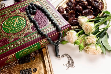 Free Photo | Close up quran and bouquet of flower