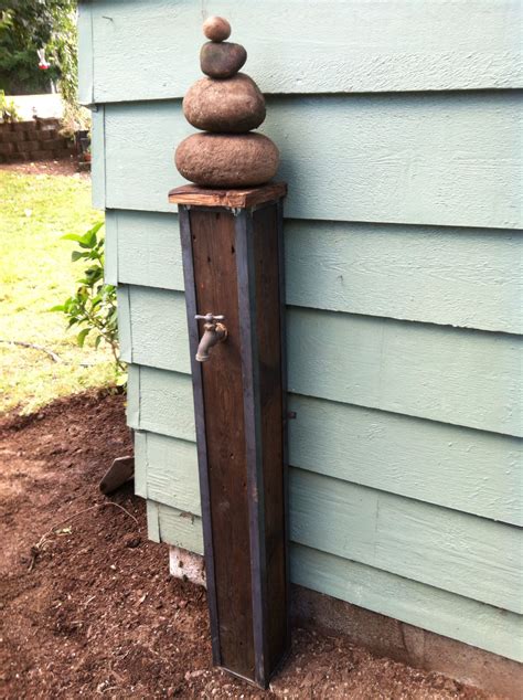 DIY Repurposed pallet wood and steel into a decorative garden spigot ...