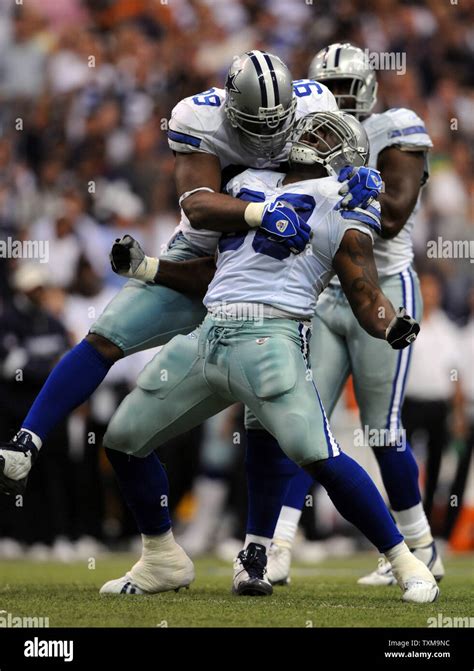 Dallas Cowboys Greg Ellis, center, and Chris Canty, celebrate Ellis's ...