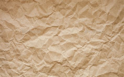 Brown crumpled paper background. Old paper texture. Ancient page pattern. Stock Photo by blazhulia