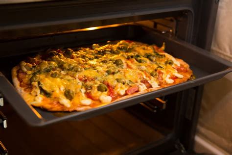 Baking pizza in oven. stock image. Image of glass, meat - 44900319