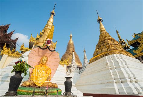 The Buddha statue and group of small pagoda in Shwedagon pagoda of ...