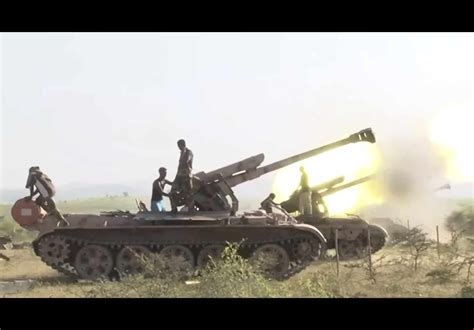 Eritrean Army T-55/54 with D-30 howitzers mounted on top, during the ...