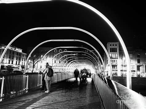 Night Walk across the Millennium Bridge in Dublin Photograph by John Rizzuto | Fine Art America