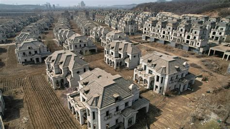 A peek inside a ghost town of abandoned mansions in China ...