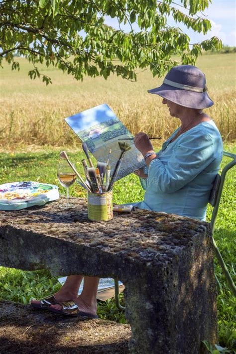 A Lady Artist Sits in Shade Working on a Painting Stock Image - Image of europe, oils: 163196849