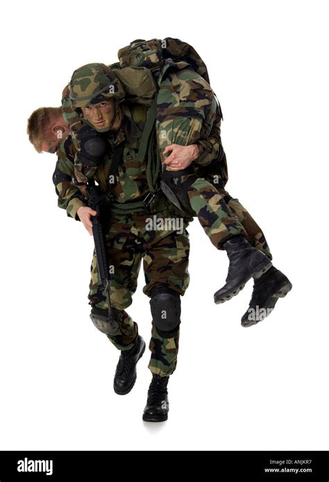 Soldier carrying an injured soldier on his shoulders Stock Photo - Alamy