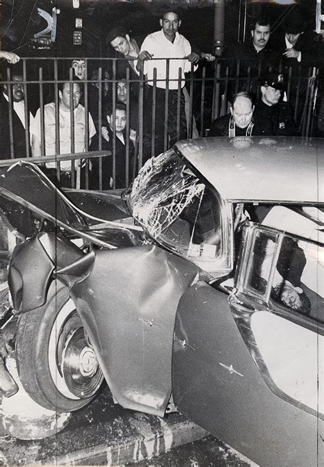 an old black and white photo shows the damage of a car