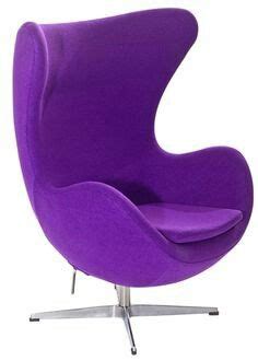 an egg chair with purple upholstered fabric