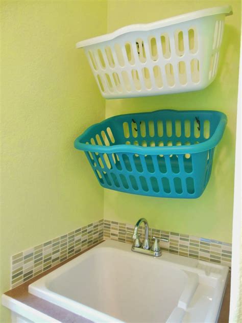 hang laundry baskets on hooks | Laundry room diy, Diy laundry basket, Laundry basket storage